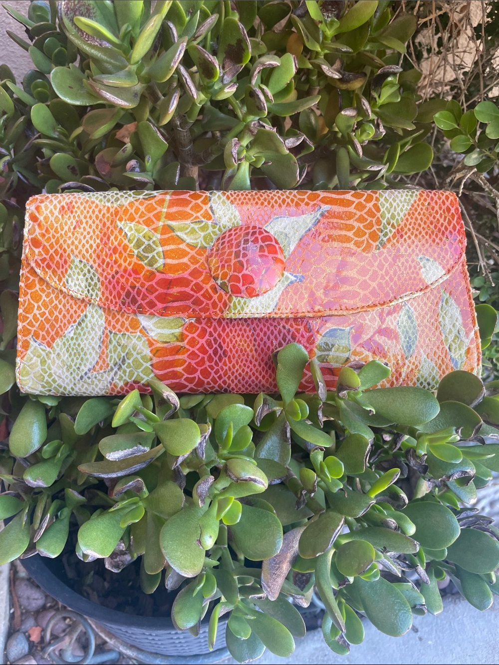 HOBO Orange Floral Embossed Leather Clutch